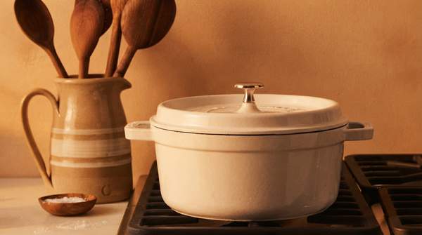 Editorial illustration for Lodge, Goldilocks, and the Le Creuset Question: Which Affordable Dutch Oven Earns Its Price?